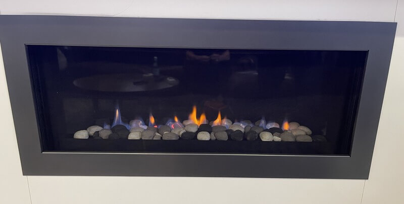 A gas log fireplace in action