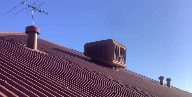 Outdoor unit of an evaporative cooling system on the rooftop of an Australian home. 