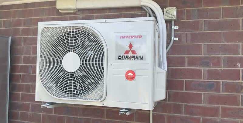 Outdoor unit of a Mitsubishi inverter air conditioner.